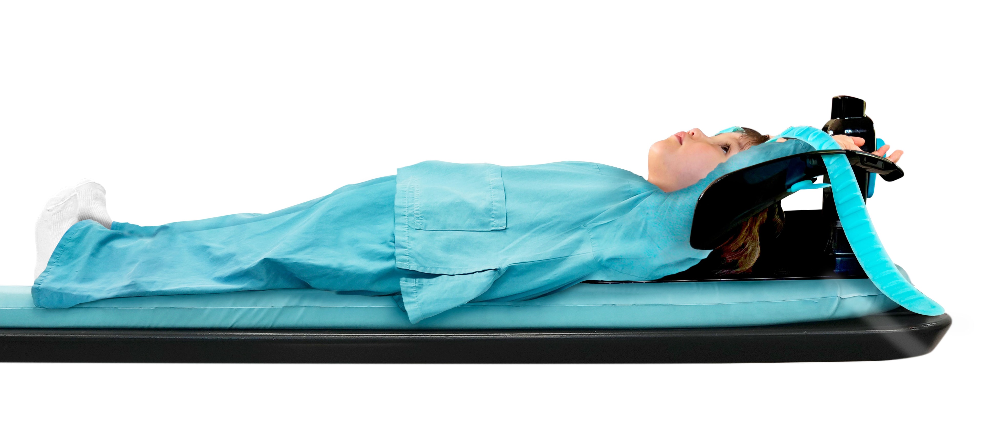 Child patient positioned with both arms overhead using the Adept Medical Overhead Arm Support MR Safe – Small. Compact design fits through CT and MRI bores 600 mm or larger.