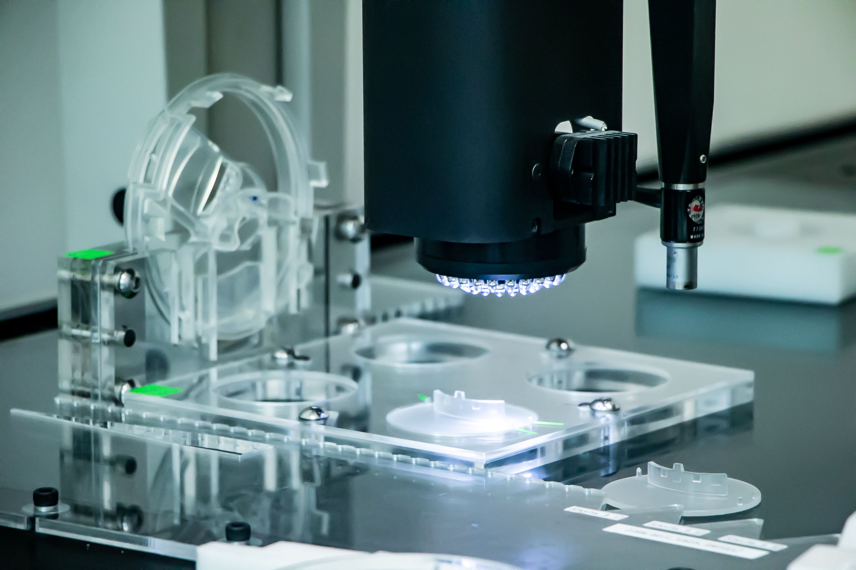 Bald man smiling in front of a building with an ADEPT sign.